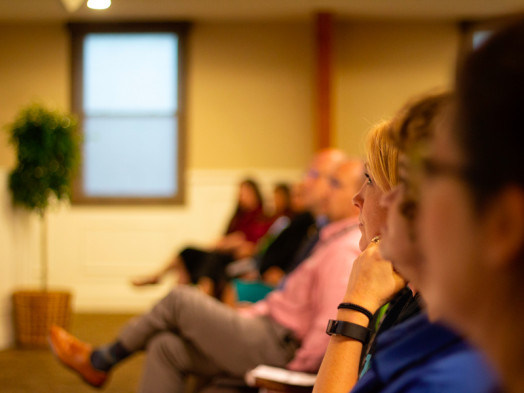 people attending a research seminar
