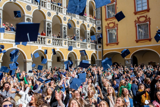 graduates tossing hats