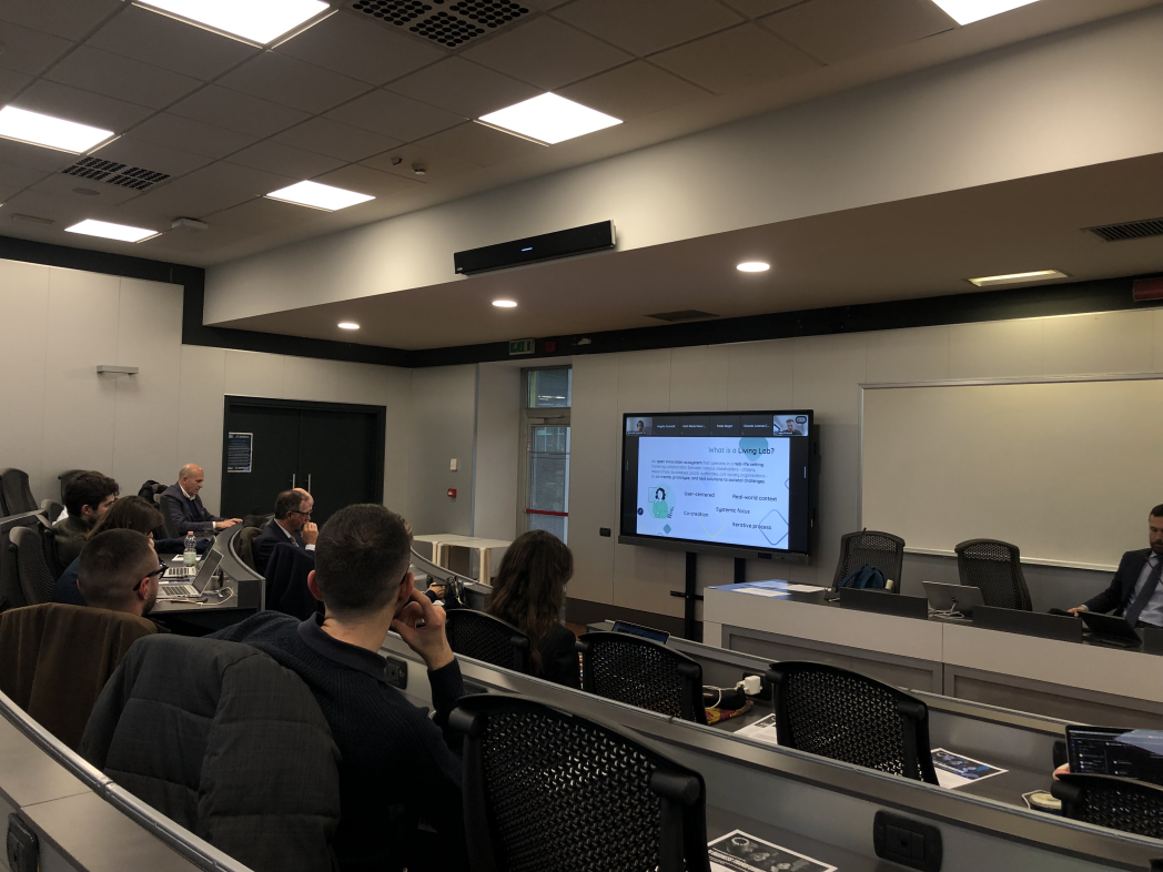 Participants at the workshop assisting at a presentation