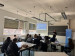 people attending a seminar and listening to the speaker