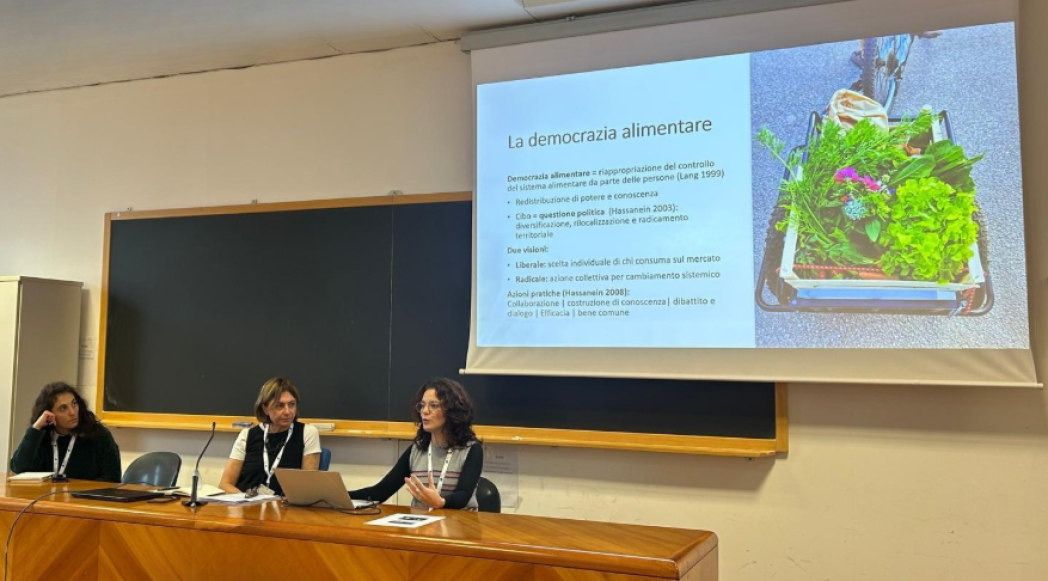 Conference presenters speaking to the audience