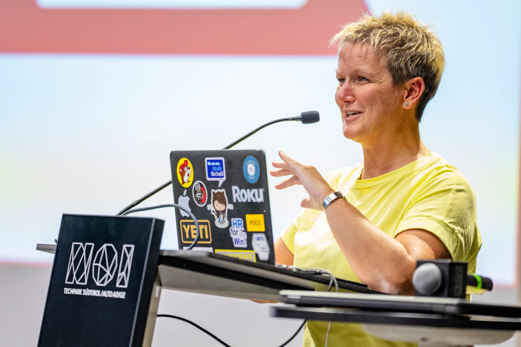 Women talking on a microphone.