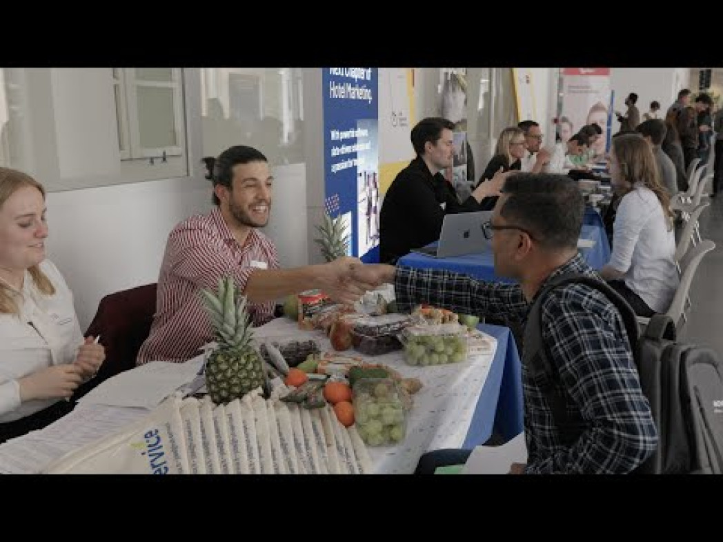 People introducing themselves in a job interview setting