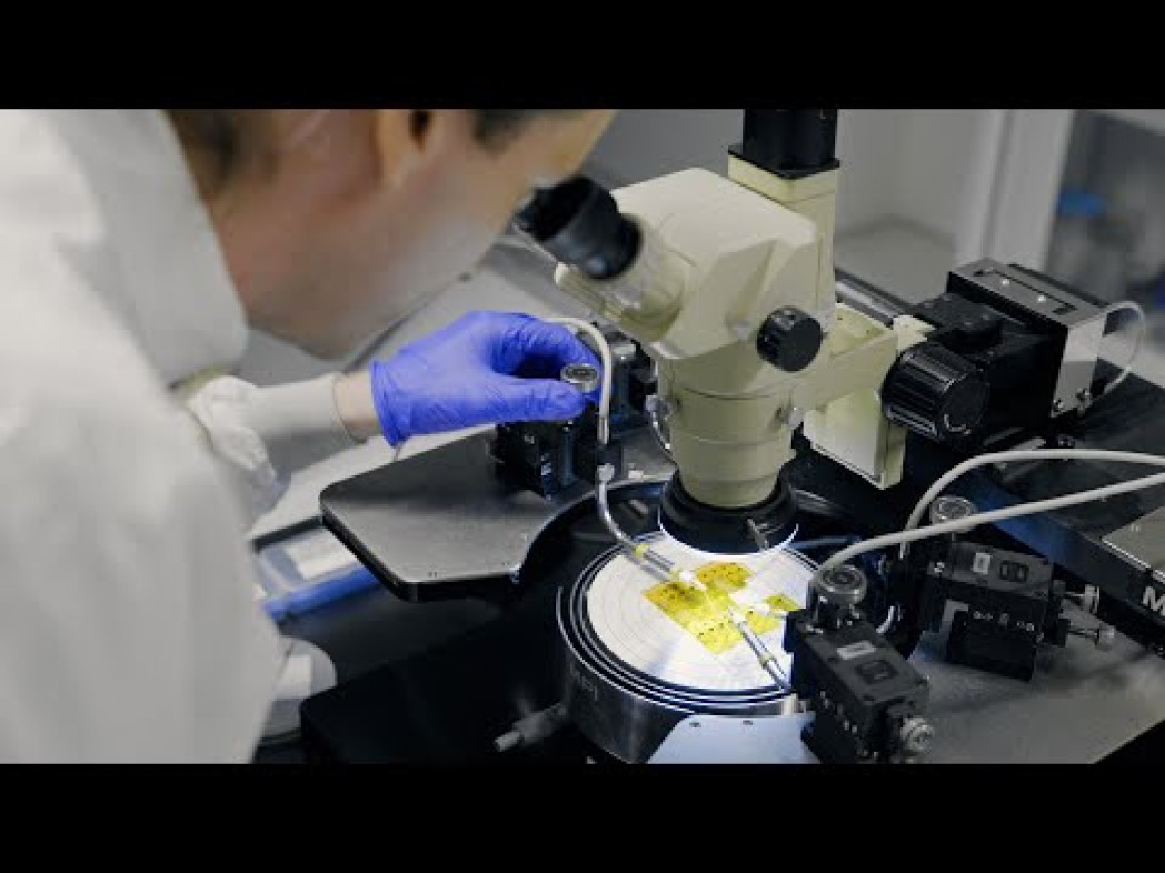 Person undergoing examination under a microscope.
