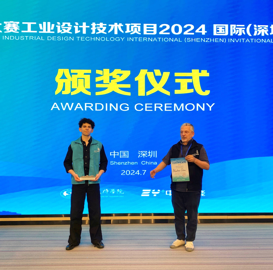 two men stand on a stage