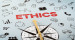 Kompasss vor Schriftzug mit Titel "Ethics"